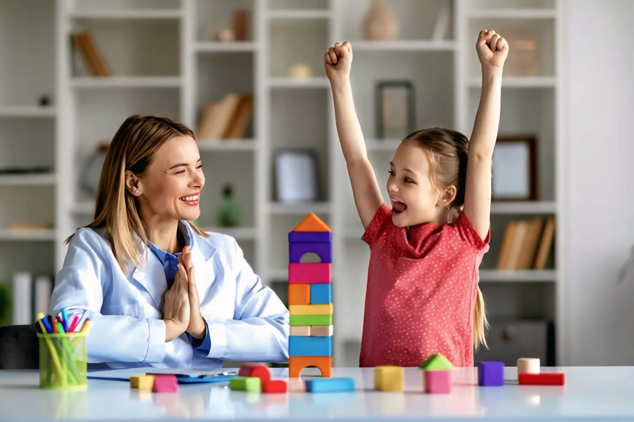 Psychologist supporting a child during a play-based therapy session at Speech Rehab Clinic